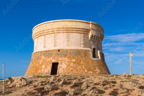 Torre de Fornells, coastal defense tower to guard the entrance to Fornells harbour. Menorca, Spain