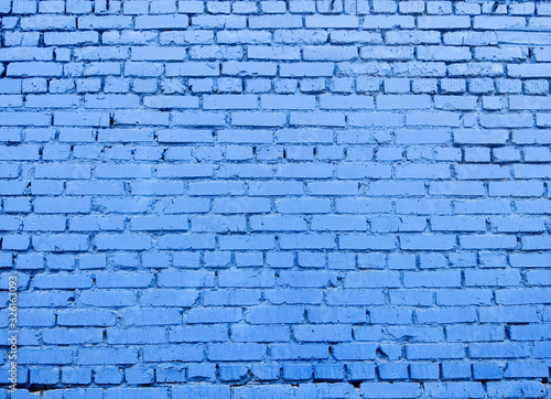 View of the old blue brick wall. Colored ancient brick background with free space for text or image .
