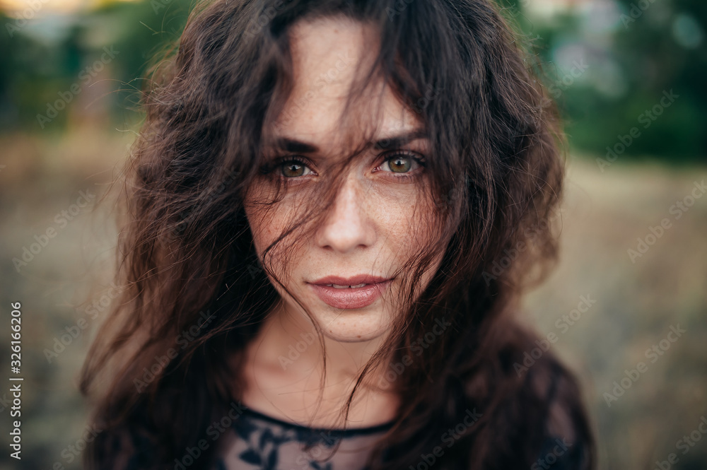 Close-up portrait of a beautiful girl with magnificent curly hair. Close-up portrait of a beautiful girl with magnificent curly hair.