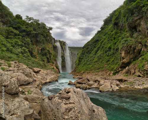 Green Background Scenic view of spectacular Tamul Waterfall, Tampaon River, Huasteca Potosina, Mexico