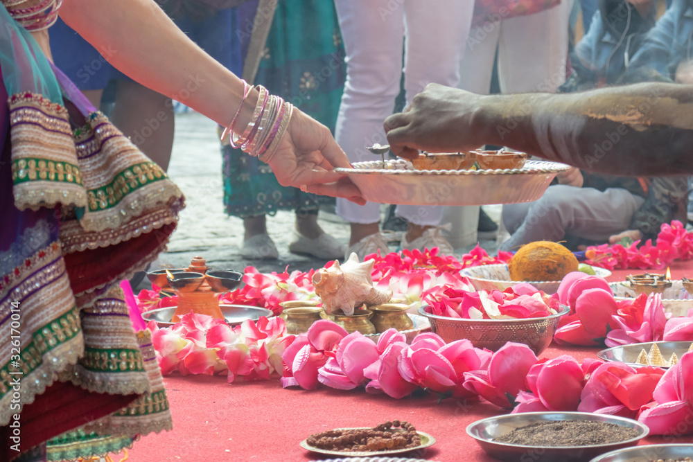 Wedding ceremony, traditional indian hindu marriage ritual with red flowers and attributes - obrazy, fototapety, plakaty 