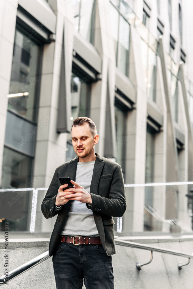 A man in smart casual is chatting on the phone A man in smart casual is chatting on the phone