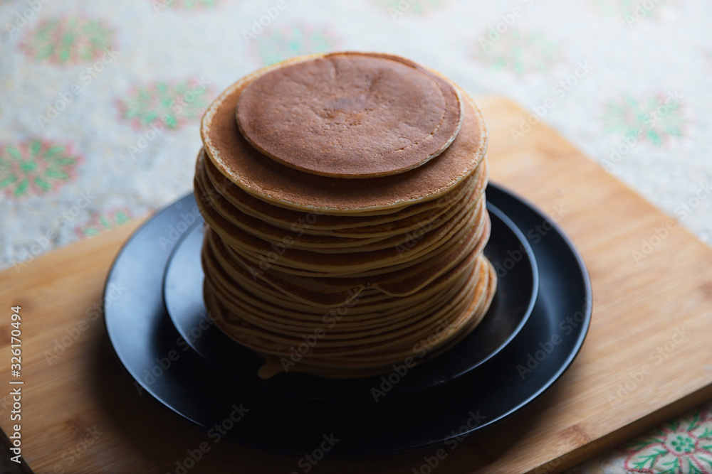 Stack of pancakes. Classic Russian dessert. The holiday of Maslenitsa. Stack of pancakes. Classic Russian dessert. The holiday of Maslenitsa.