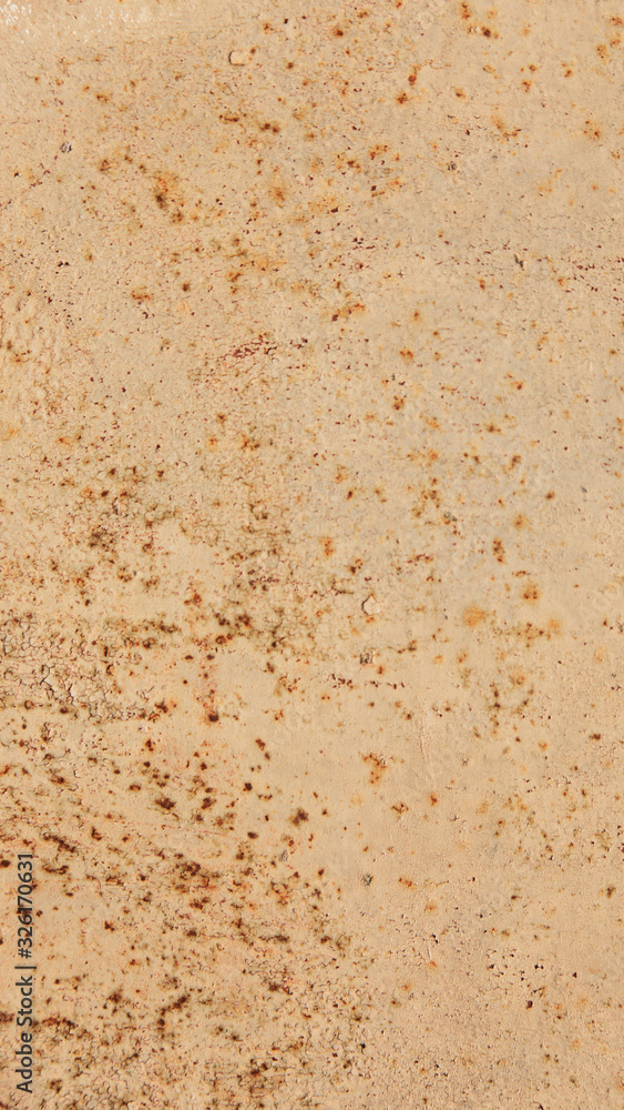 Rusty metal wall, old sheet of iron covered with rust with paint vertical background texture Rusty metal wall, old sheet of iron covered with rust with paint vertical background texture