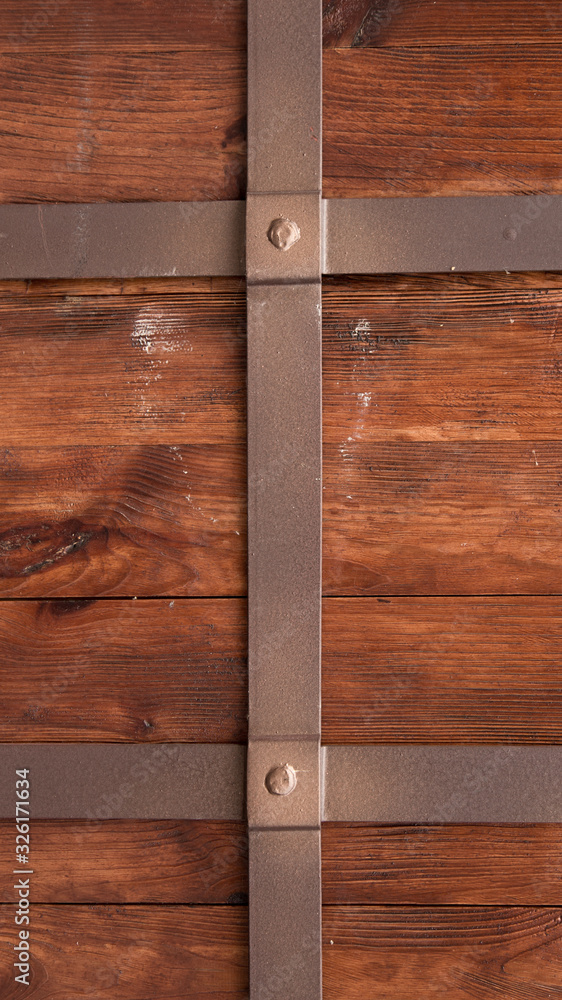 Vertical ancient wooden door background. Wallpaper for your device