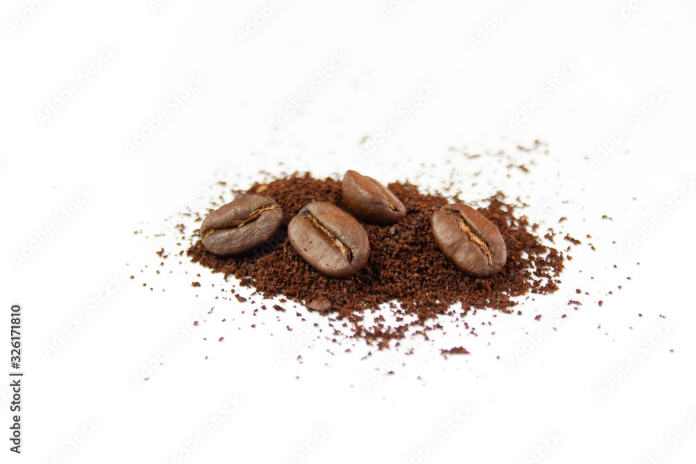 Coffee beans and ground coffee on a white background
