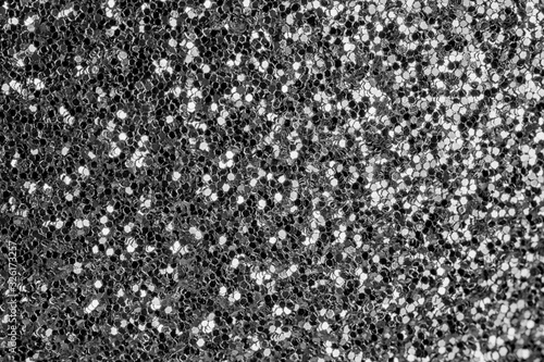Shiny silver background. Small sparkles close-up. The basis for sites and layouts.