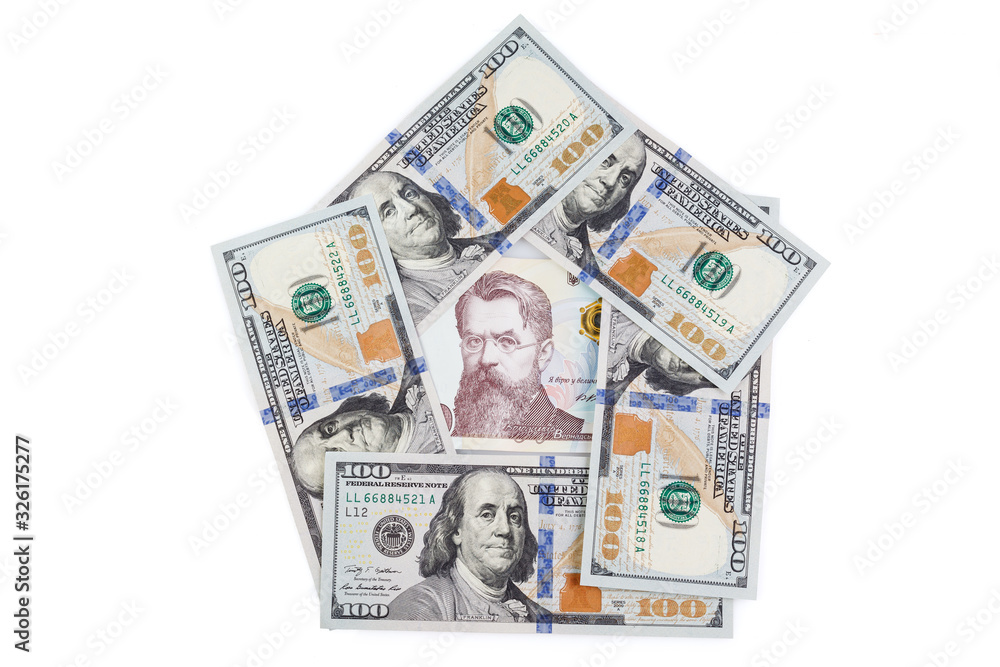 Ukrainian money - hryvnia banknotes USA dollars bills. Finance in Ukraine, of the hryvnia to the dollar exchange rate. Close-up concept finance investment. Ukrainian money - hryvnia banknotes USA dollars bills. Finance in Ukraine, of the hryvnia to the dollar exchange rate. Close-up concept finance investment.