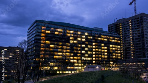 generic health care: modern hospital exterior timelapse photo