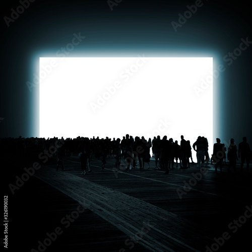 Φωτογραφία Group of silhouetted people stand in front of ominous light