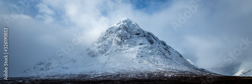 buachaille etive mor in glencoe and rannoch moor shot in winter showing fresh white snow on the mountain in the argyll region of the highlands of scotland