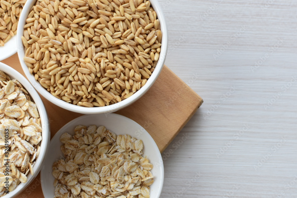 Oat grains and flakes in containers for display Oat grains and flakes in containers for display