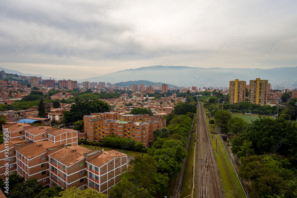 San Javier Neighborhood, Metro Railroad and Skyline Aerial View in Medellin, Antioquia / Colombia