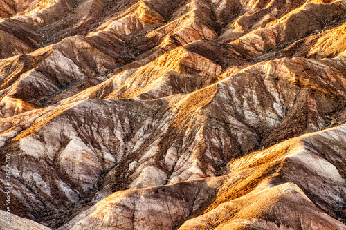 Badlands view from Zabriskie Point in Death Valley National Park at Sunset