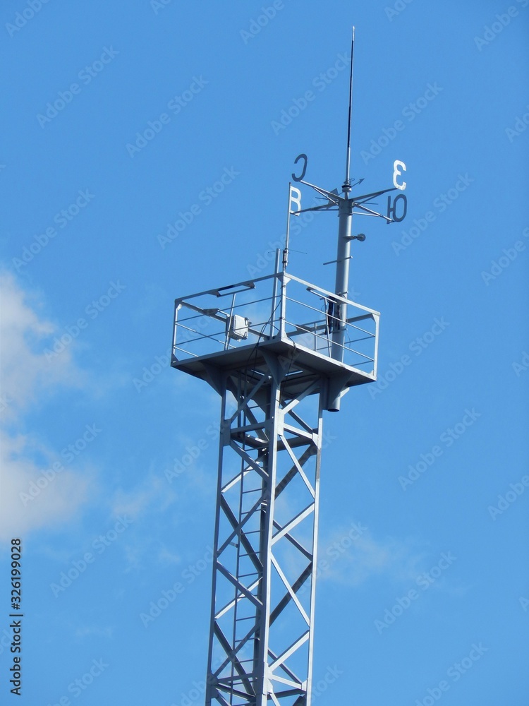 Tall tower with weather vane for meteorological observations. Tall tower with weather vane for meteorological observations.
