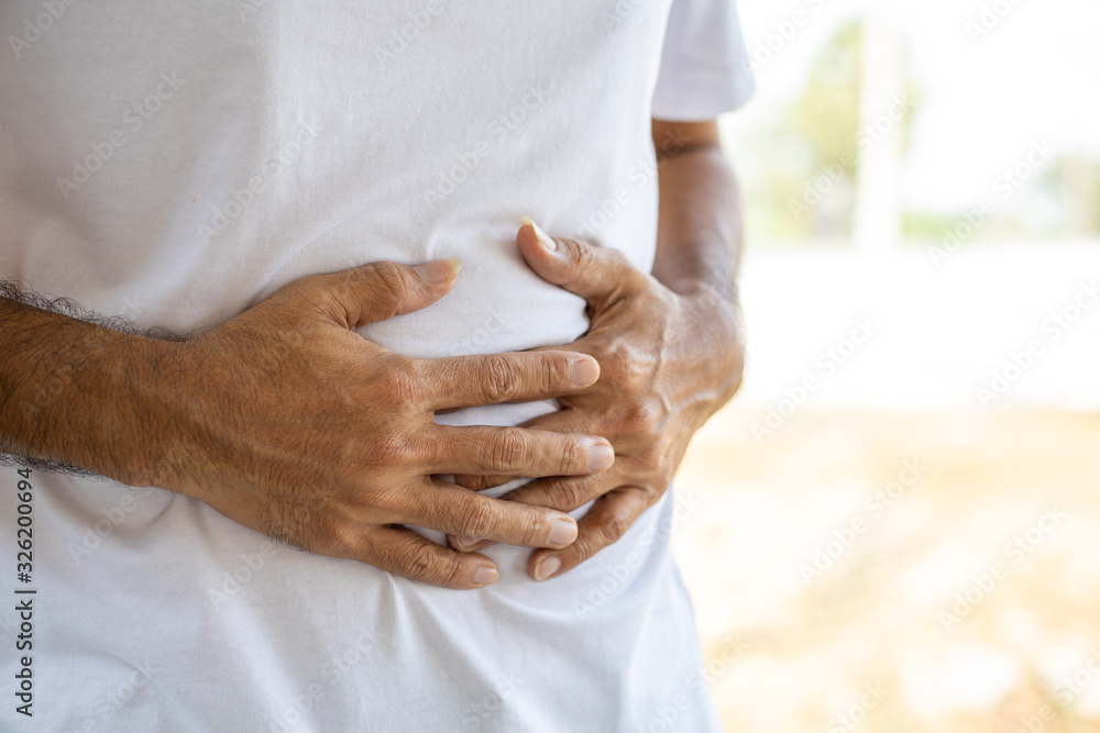 Close up Man having painful stomach ache, Health problem concept Close up Man having painful stomach ache, Health problem concept