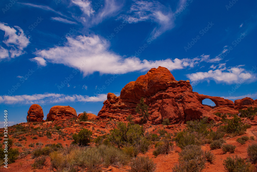 Fototapeta premium Clouds Over Sandstone in Arches National Park