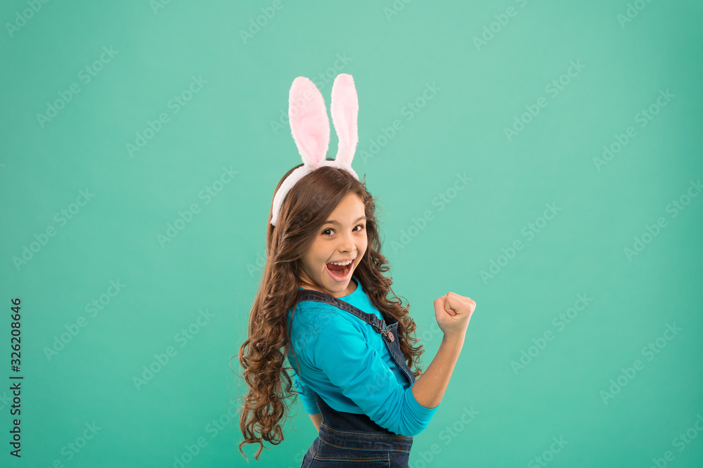 Ive got power. Girl power. Super kid with bunny ears flex arm. Happy