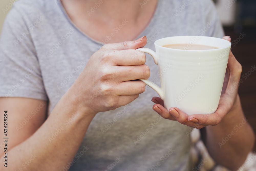 woman at home with cup of tea woman at home with cup of tea
