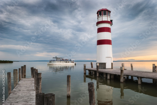 Lighthouse with Passenger Boat at Sunset in Podersdorf at Neusiedl Lake, Austria © kaycco