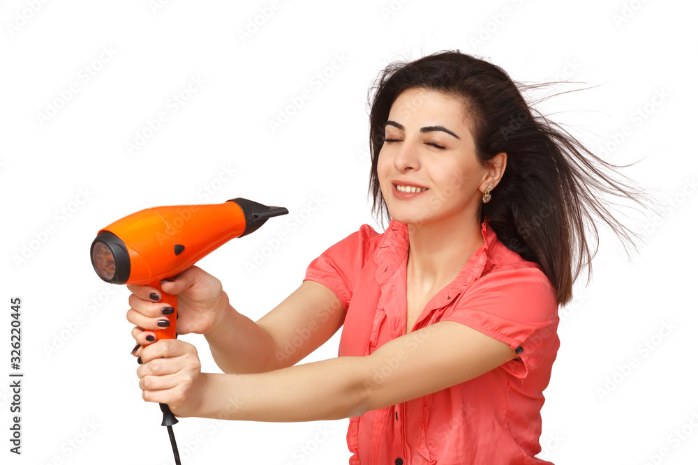 Young beautiful girl dries her hair with a hair dryer Young beautiful girl dries her hair with a hair dryer
