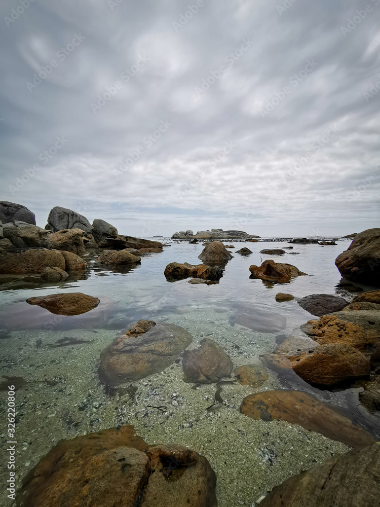 Beautiful sky over ocean water with rocks Beautiful sky over ocean water with rocks
