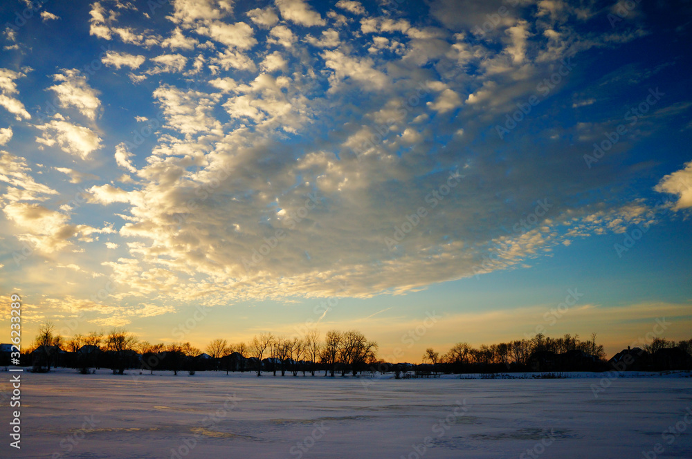 sunset on frozen lake