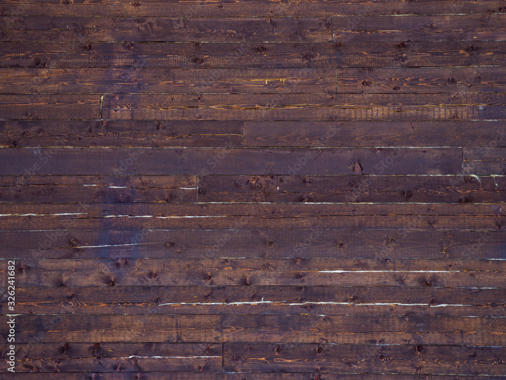 Naklejka premium Texture of a wooden wall from old crimson boards. Siberian larch