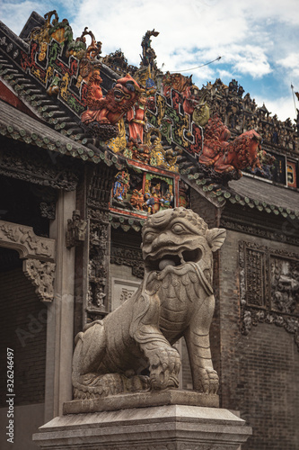 Fu dog at the entrance of Chen Clan Ancestral Hall. Chinese temple, great tourist museum. Asian travel and destination. Art in the roof. Antique building.