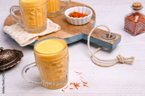 Yellow smoothie in glass photo