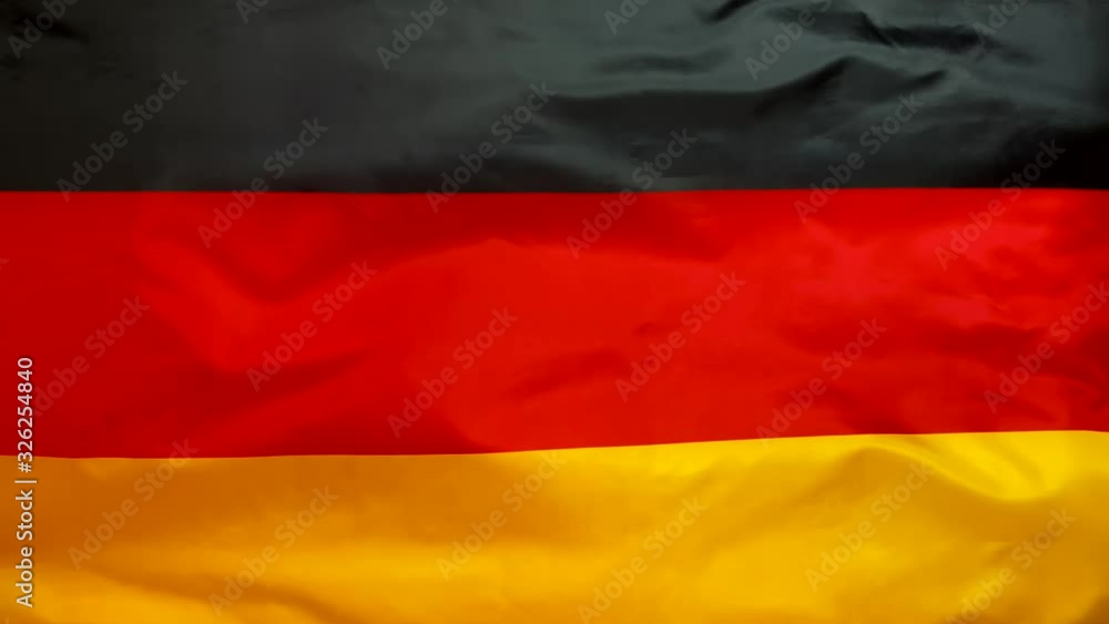 Germany flag waving in the wind. German flag close up. Germany flag waving in the wind. German flag close up.