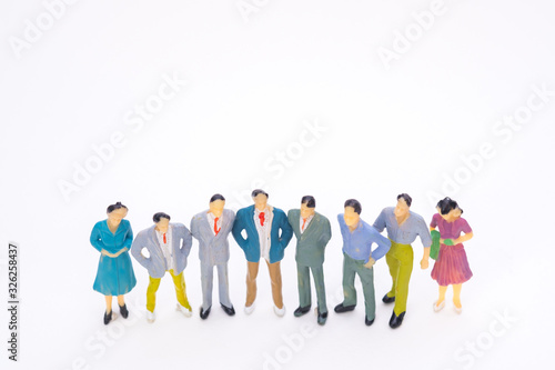Group of figure miniature businessman or small people investor and office worker secretary on white background for money and financial business teamwork concept.