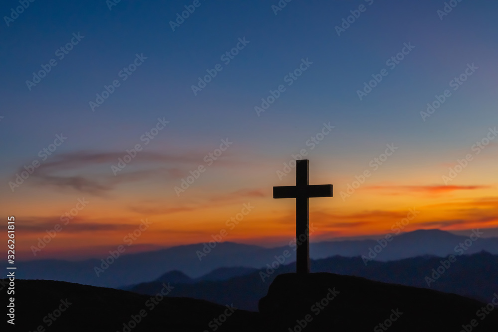 The silhouette of the crucifixion of Jesus Christ - crossing at sunset