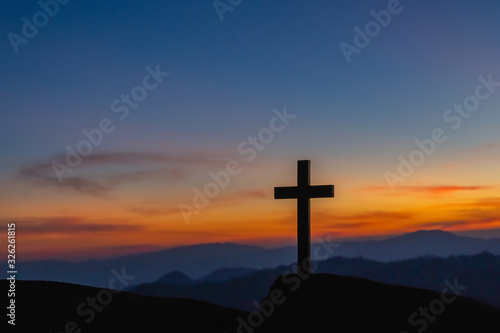 The silhouette of the crucifixion of Jesus Christ - crossing at sunset