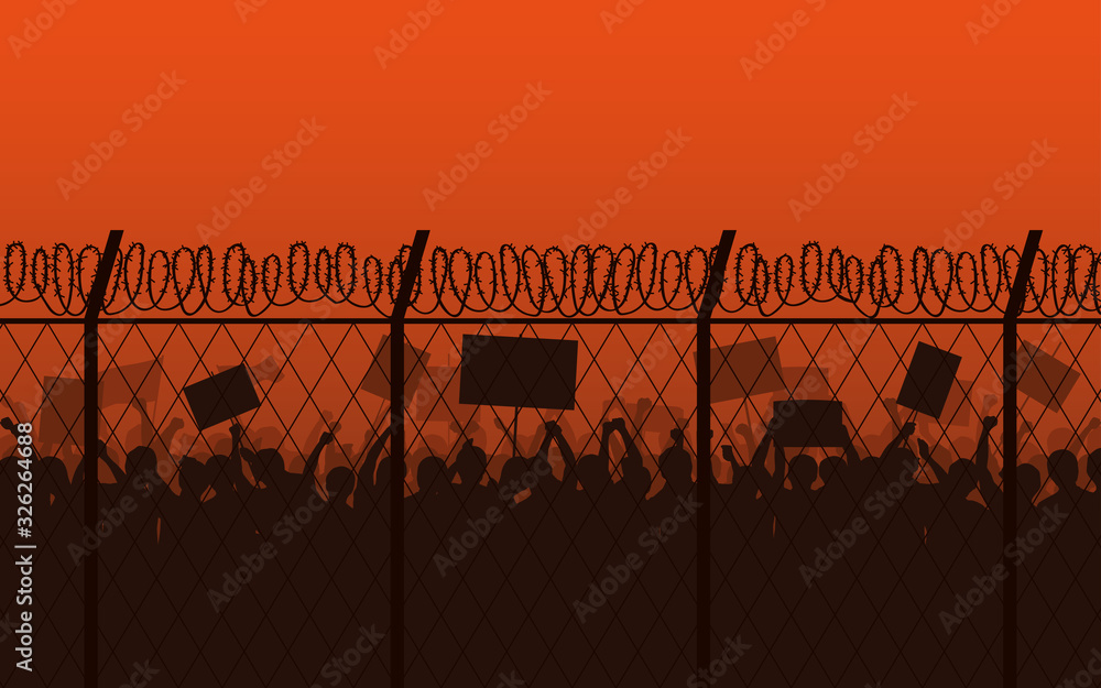 Φωτογραφία Silhouette group of Protester Raised Fist and Signs at border with barbed wire f