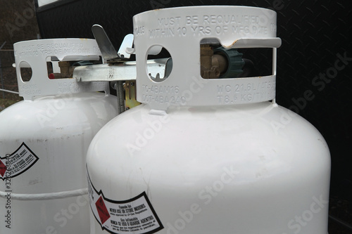 Cuadro en lienzo Two 20 pound propane tanks secured to the front of an RV travel Trailer
