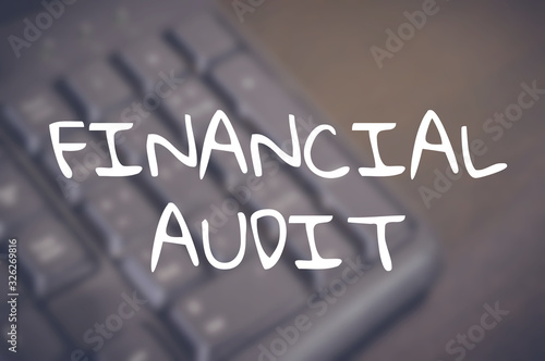 Financial audit word with business blurring background