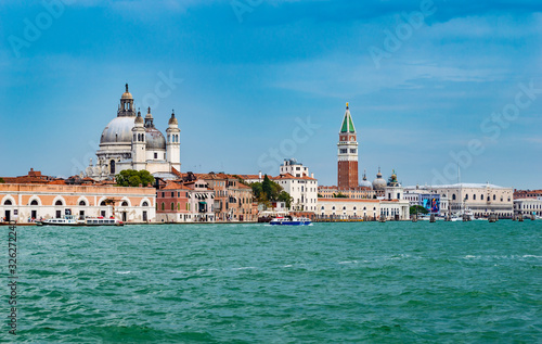Venice, Italy - CIRCA 2013: Venice buildings and Basilica San Marco tower as seen from Venice lagoon.