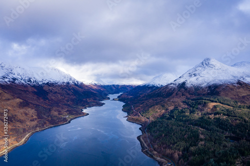 aerial drone shot of winter in glencoe and and loch Leven in the argyll region of the highlands of scotland showing clear bright white snow on the mountains of glencoe and the surrounding region © Andy Morehouse