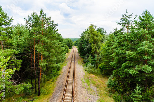 Old railroad in forest on summer