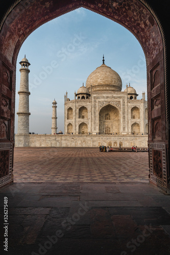 view of taj mahal from an marble arch frame   vertical