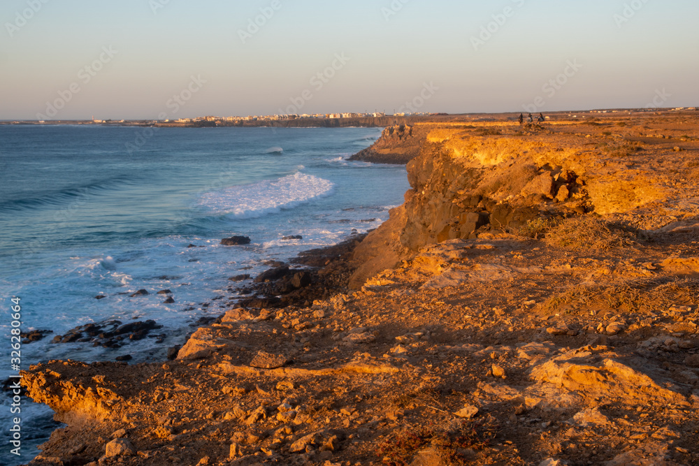 Fuerteventura rocky coast in the light of the setting sun