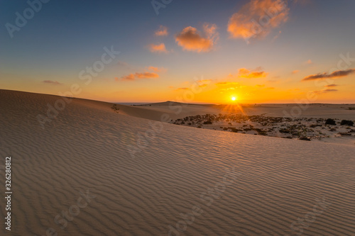 Sand dunes in the National Park of Dunas de Corralejo during a beautiful sunrise- Canary Islands - Fuerteventura.