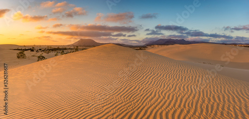 Fototapeta Naklejka Na Ścianę i Meble -  Beautiful landscape of sand dunes  in the National Park of Dunas de Corralejo , Canary Islands ,Fuerteventura.