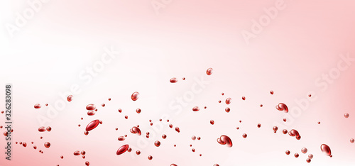 Flying red drops on pink background