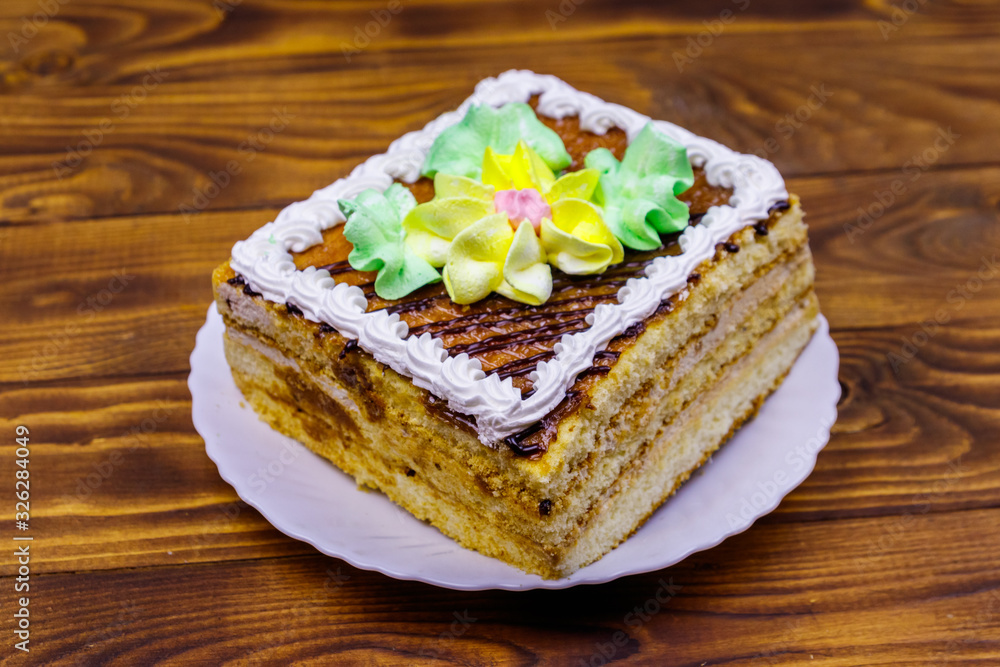 Tasty sweet cake on a wooden table Tasty sweet cake on a wooden table