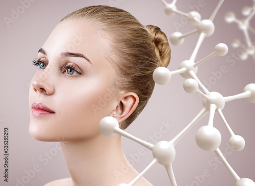 Young woman with big white molecule chain.