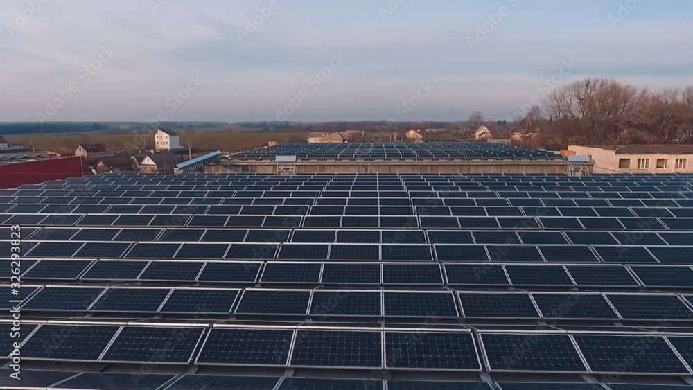 Top view of solar panel rooftop. Aerial view of solar panels installed on roof of factory