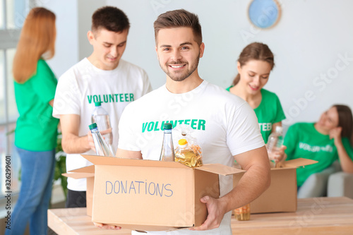 Team of volunteers with pro...