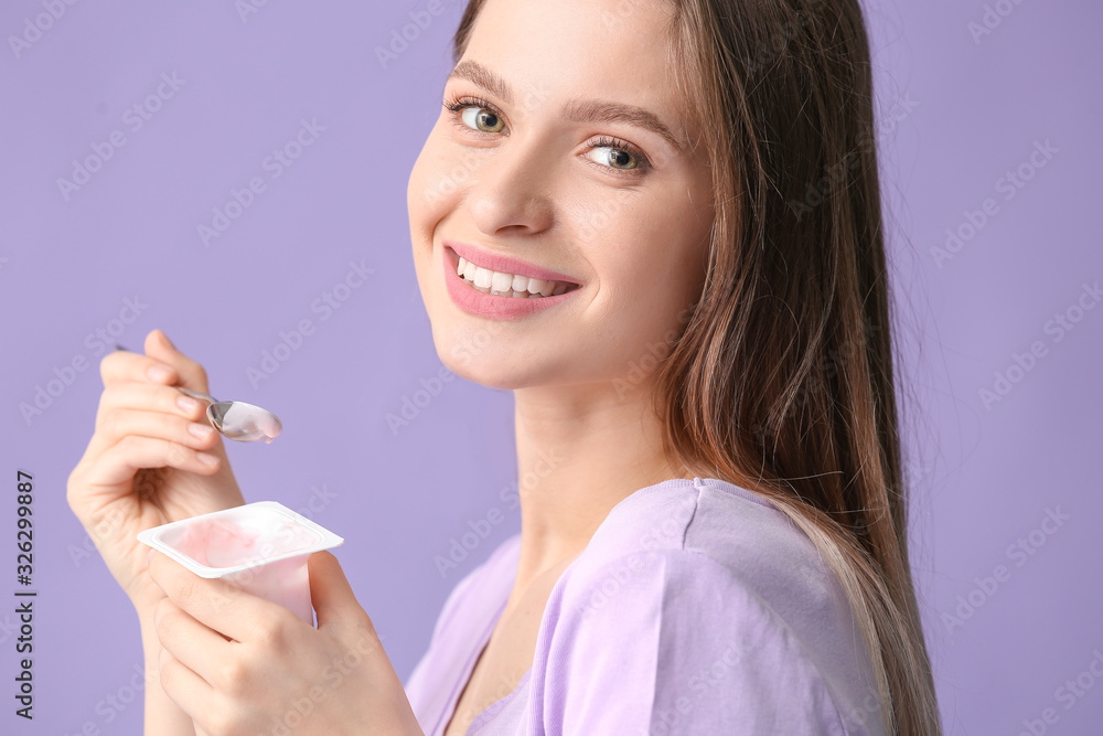 Young woman with tasty yogurt on color background Young woman with tasty yogurt on color background